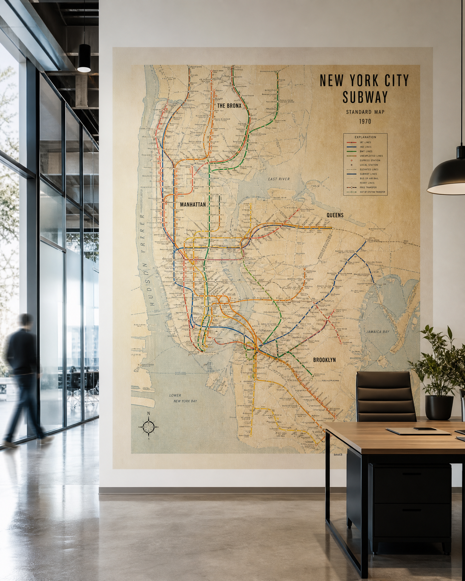 NYC subway map printed as a high-resolution mural in a modern office